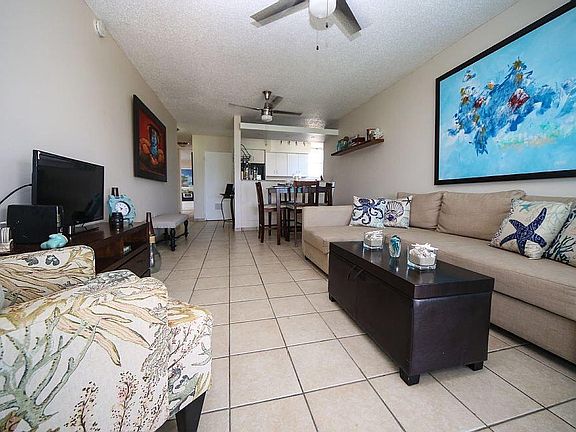 Open kitchen to dining to living to balcony area