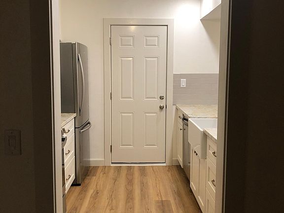 galley kitchen, door opens to attached garage with laundry