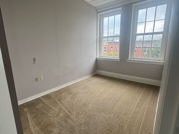 Representative Unit 304 bedroom, from the July 2025 property photo report. Features and layouts vary by apartment.