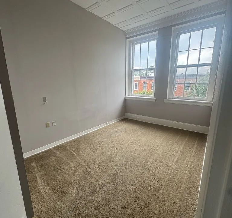Representative Unit 304 bedroom, from the July 2025 property photo report. Features and layouts vary by apartment.
