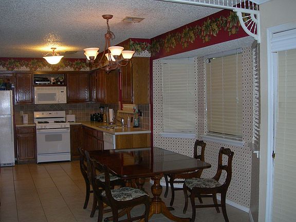 open kitchen w/Corian countertops