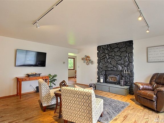 Swing open the door to find light and bright interior with fresh paint and newer luxury vinyl plank flooring.