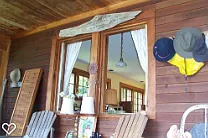 Porch with sliding 'pocket windows' looking into the kitchen.