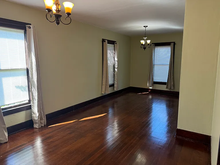 This space could be used as a dining room or use this whole area as your living room!