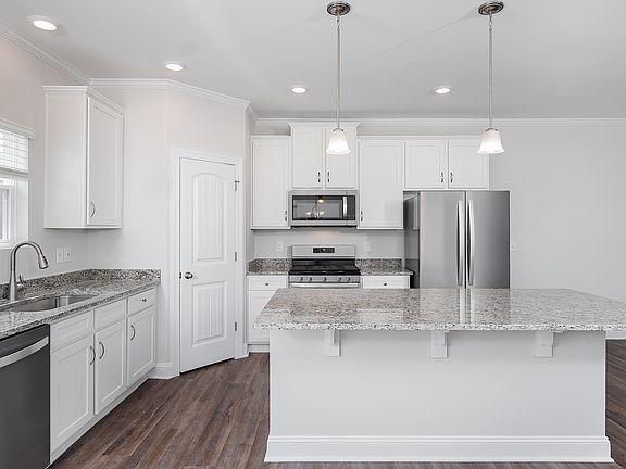 The kitchen has brand-new stainless steel appliances