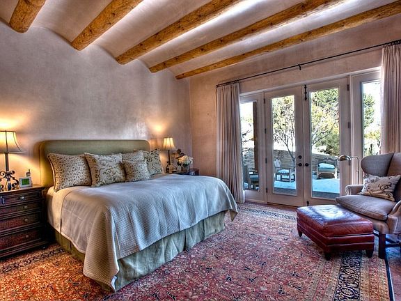 A vision of serenity & subdued style, the master bedroom is gracious & accommodating without being o