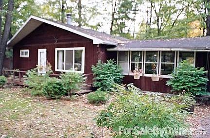 View from Street
						:
						Yard with lots of large shade trees, bushes and perennials.