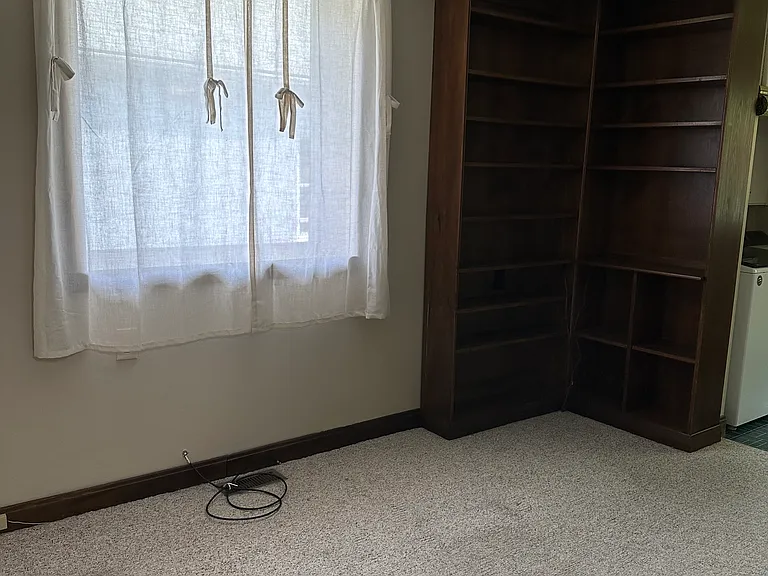 Additional room living room with built-in shelves