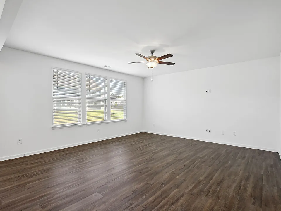 Hickory C Layout - Large living room area with ceiling fan.