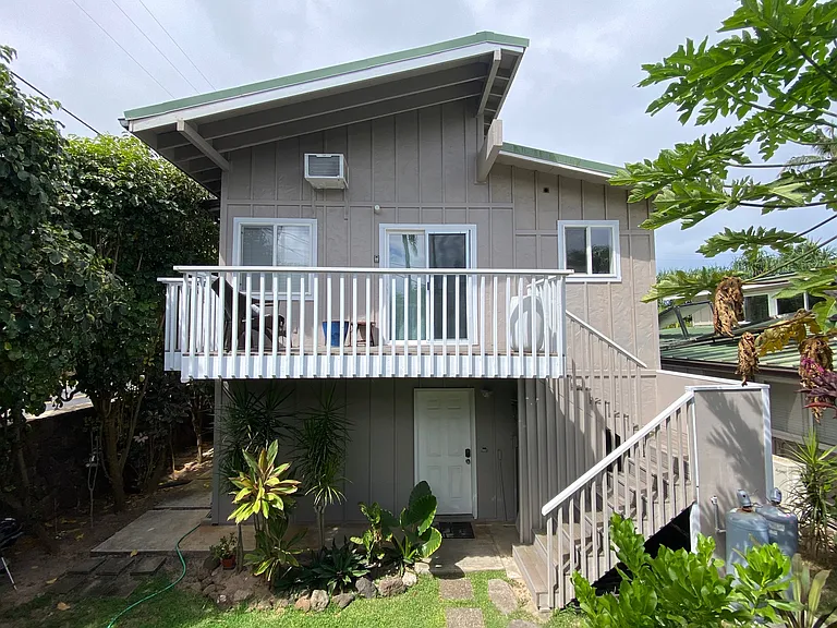 Go up the stairs to the deck and through the sliding glass doors. Walkway to the steps is on the left with the private outside hot/cold shower in that area.