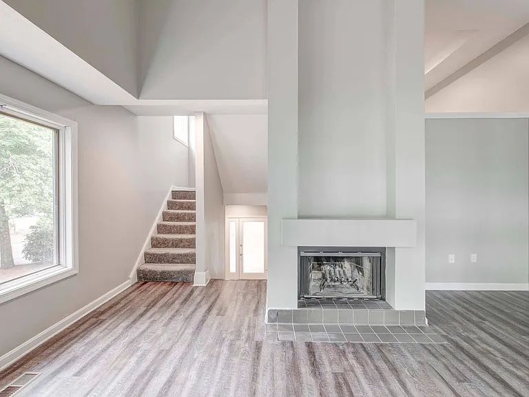 Fireplace and split-level staircase