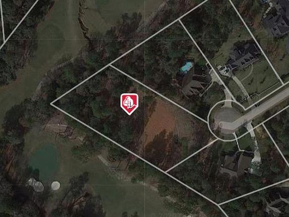 Aerial shot taken from tax records, this photo provides an excellent overview of how the lot is situated on the golf course.