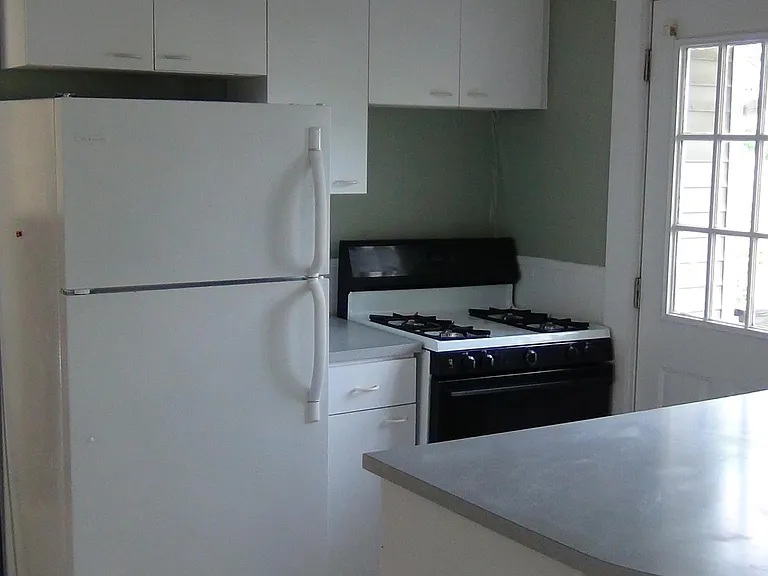 Kitchen island area with door to the private deck