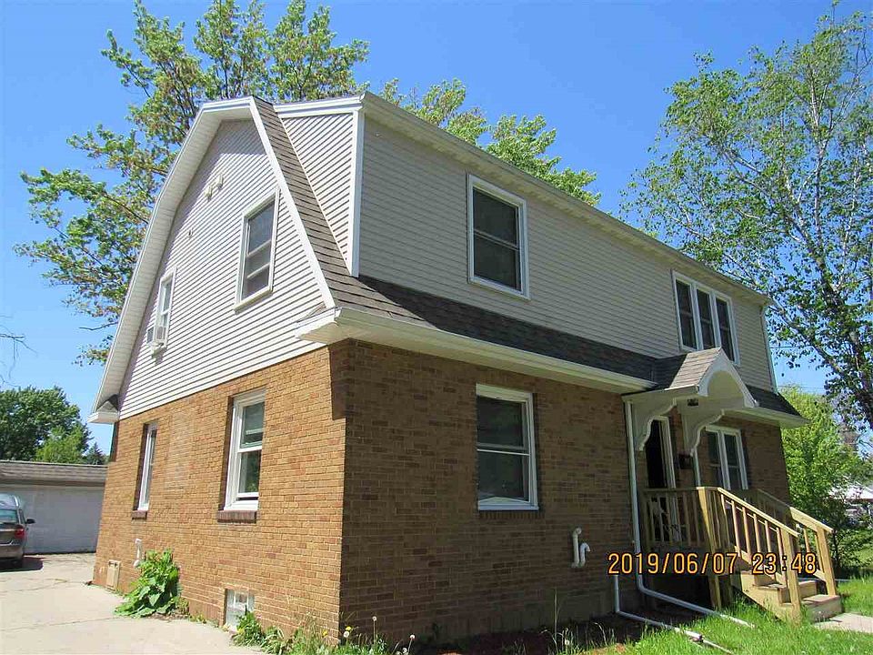 Front and side view with detached garage