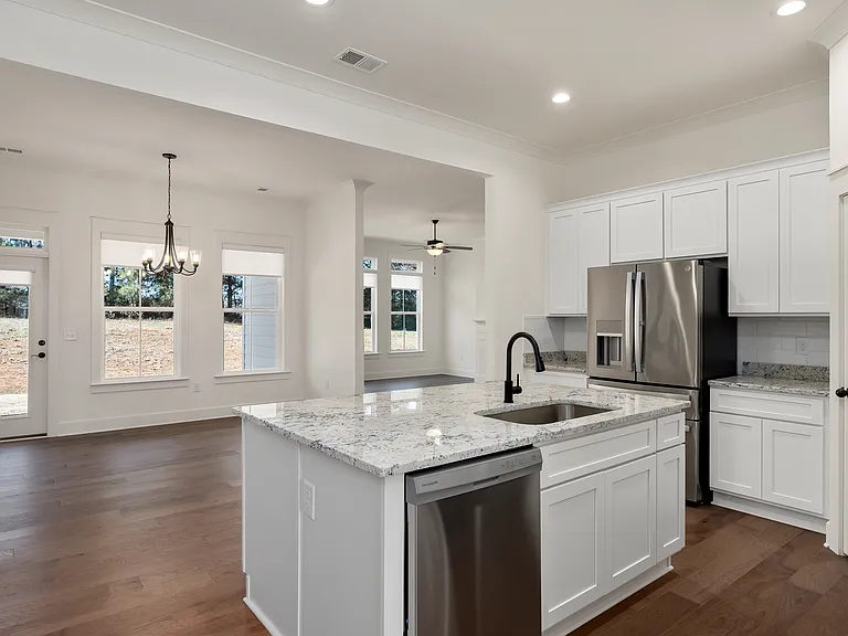 View of open floor plan showing kitchen, dinette room and family room.