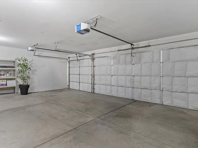 Large 3 car garage with extra insulation for better climate control