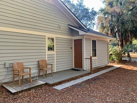 Side entry and small patio.