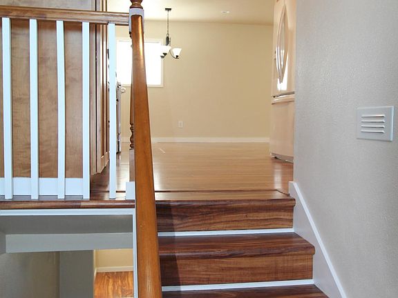 Staircase up to kitchen, living, study nook, bedroom 1, bathroom 1.