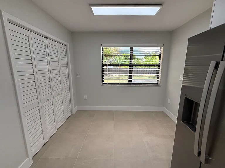 Breakfast nook inside kitchen/ Washer and dryer closet on left