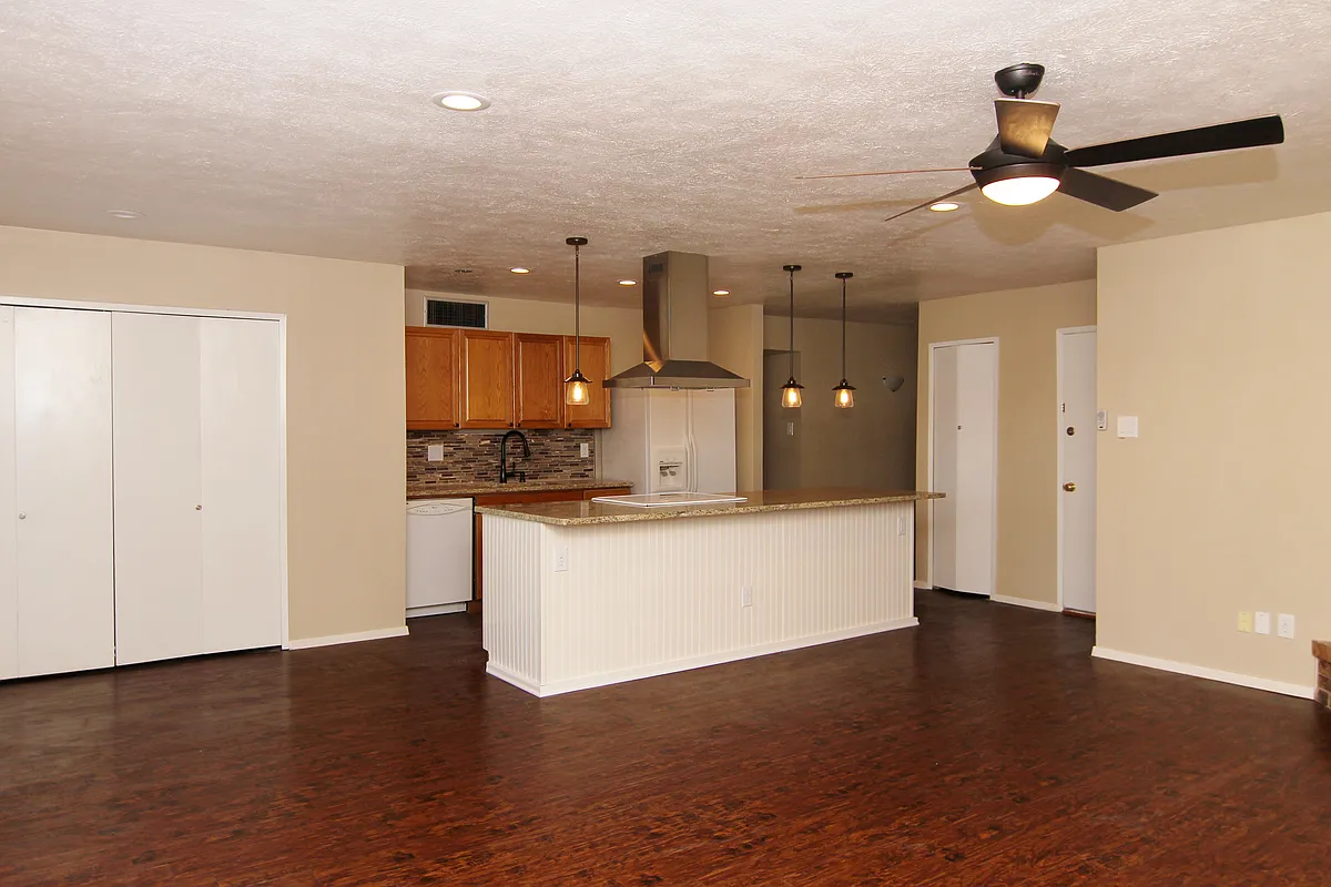 Open floor plan living/dining room with view into kitchen - 731 Leading Ln
