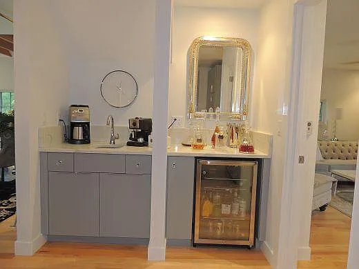 Separate beverage bar beyond the kitchen.