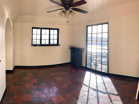 Second bedroom and dining room, Spanish tile floor, southern and western views.