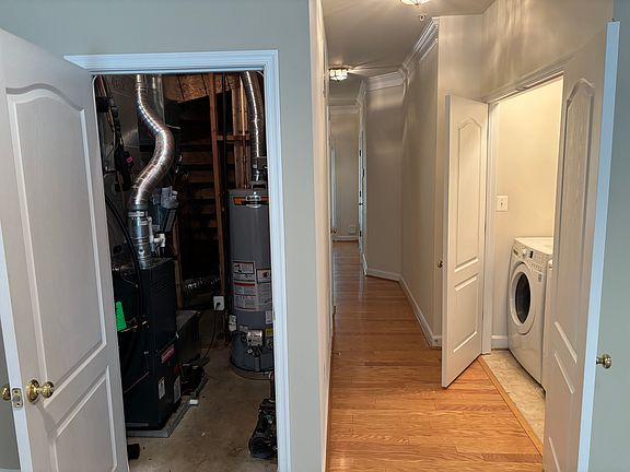 First floor hallway, utility closet at left, washer /dryer on right.