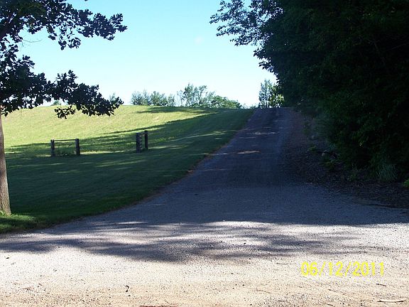 Lane going uphill to house