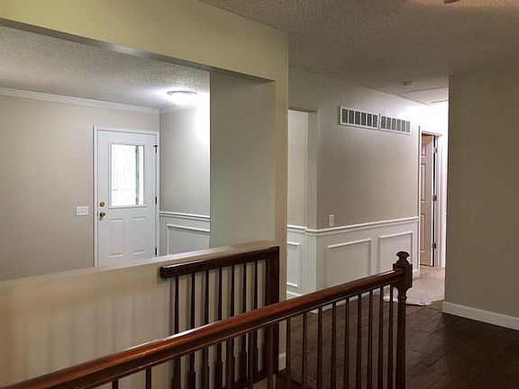 From kitchen looking at front door and hallway leading to bedrooms