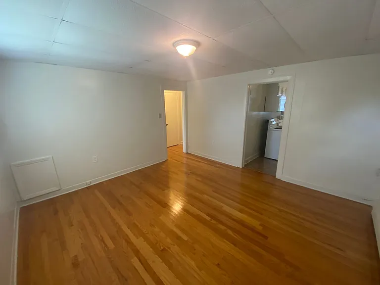 Private carport, in-unit laundry, and the Lakewood strip right outside your door. — Photo 4