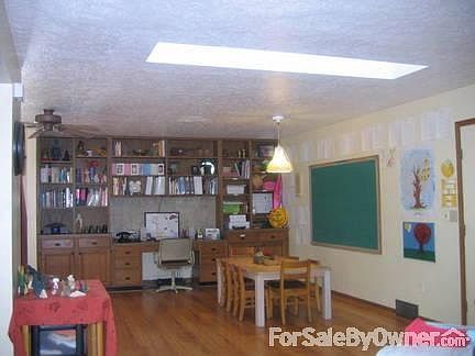 Family room
						:
						Across the space from the dining room--built-ins have tons of storage.
