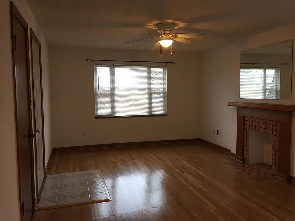 Living room with entrance door and small closet on the left