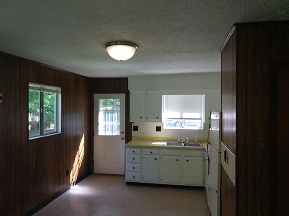 Kitchen from living area - Door is for back side of house