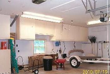 View inside of 2 12 car (24 x 30) garage. Notice a whole wall of storage cabinets. If desired, garag