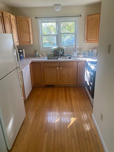 Kitchen faces front of townhouse and is open to the dining area.