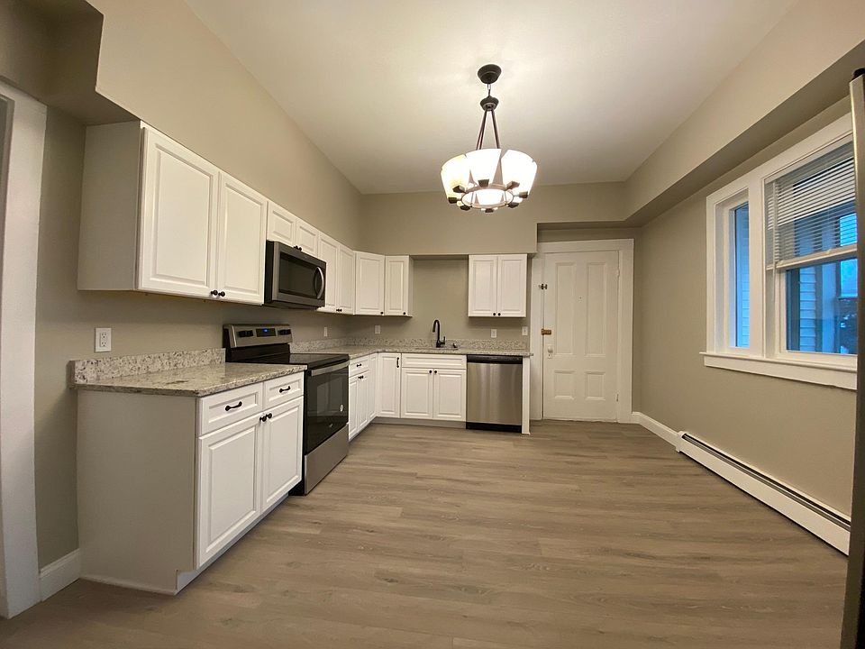 Kitchen includes fridge/freezer, range, hood, microwave and dishwasher.