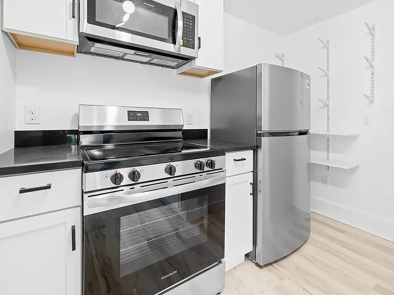 Kitchen - Second Floor. The area to the right now has shelves to act as an open pantry.