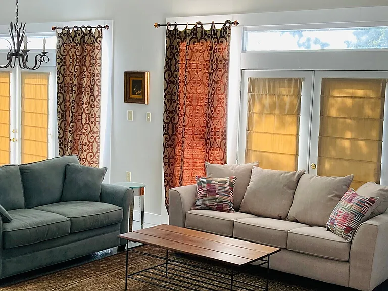 Living Area. Lots of natural light and quiet, set back at the rear of the residential lot.