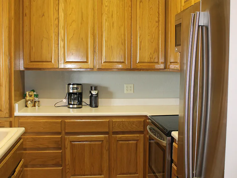 Kitchen has plenty of cabinets and pantry for storage.
