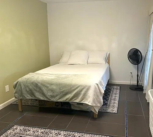 large bed with black out curtains