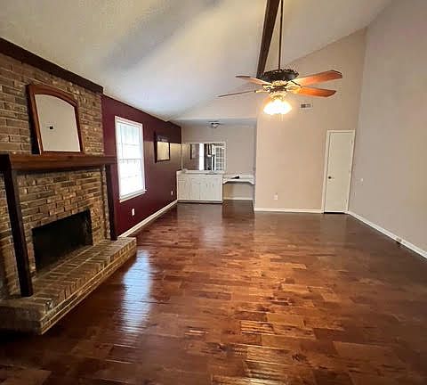 great room with beams and coat closet.