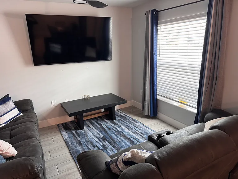 3667 Unlimited access to fully furnished common area living room, ceiling fan, 70" TV with complimentary streaming channels.
