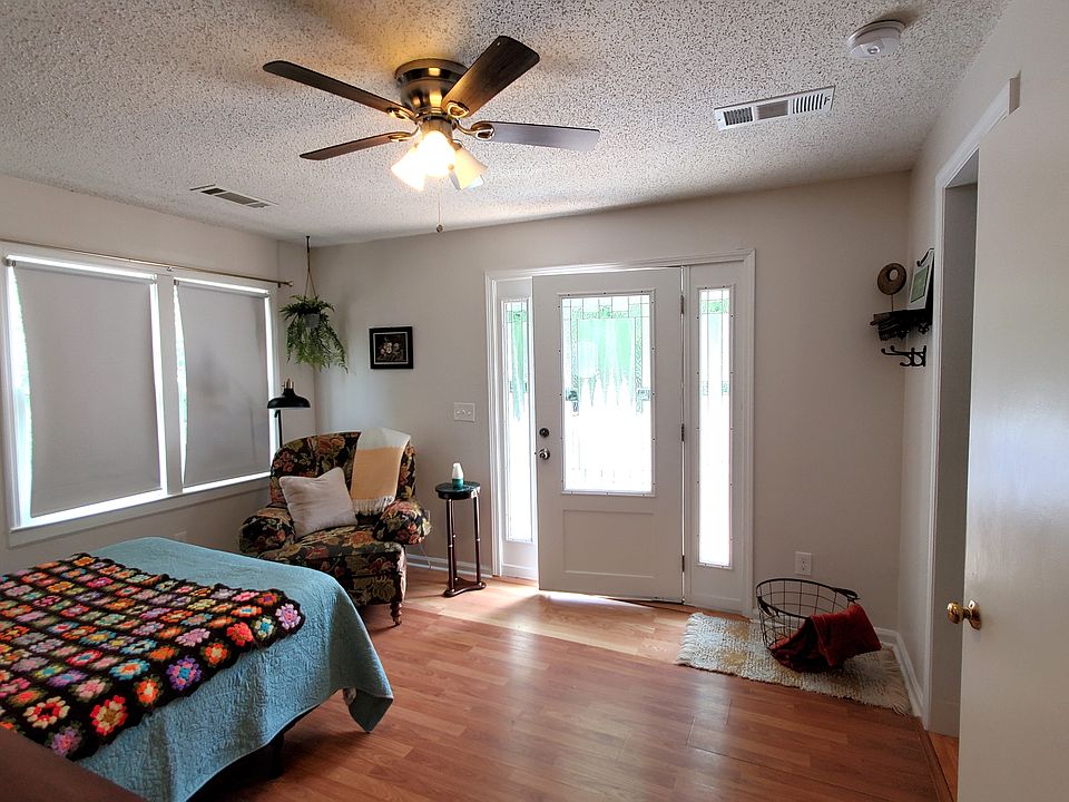view of living and sleeping area from hall