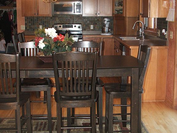 Eat in Kitchen, Stainless Appliances, Cambria Center Island, Maple Cabinetry