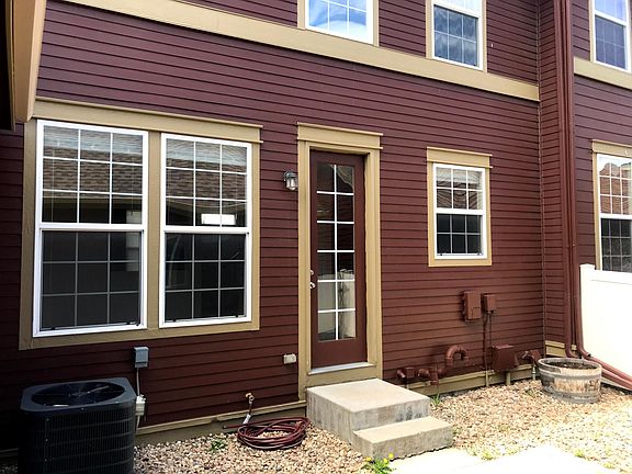Private, fenced courtyard between town-home and garage.