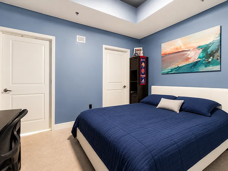 Spacious bedroom fits a king bed