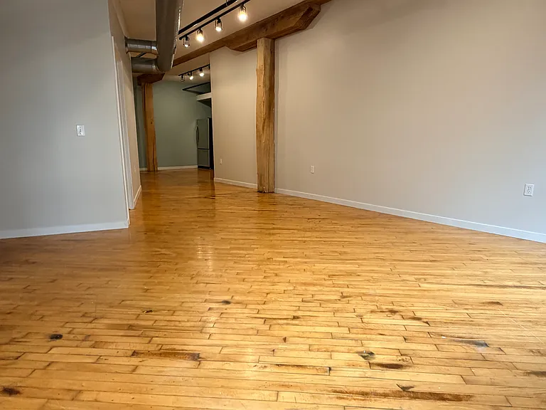 (Photos of similar unit with same floor plan. Unit 211 will have higher exposed beam ceilings. Colors, finishes, and fixtures may vary)