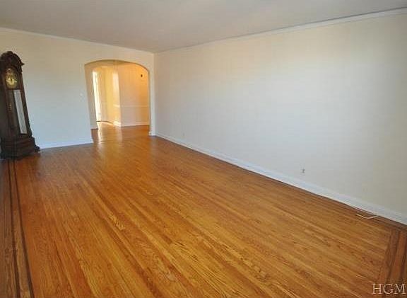 Large living room with covered hardwood floors. Room is 21' x 1