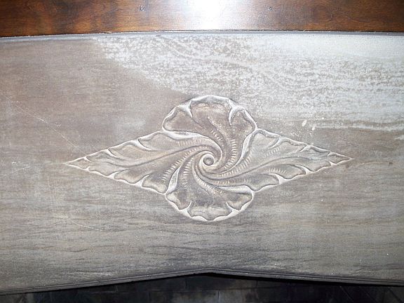 Detail of stone carving on Living Room fireplace surround.