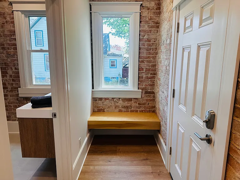 Entrance from garage and bench seat.